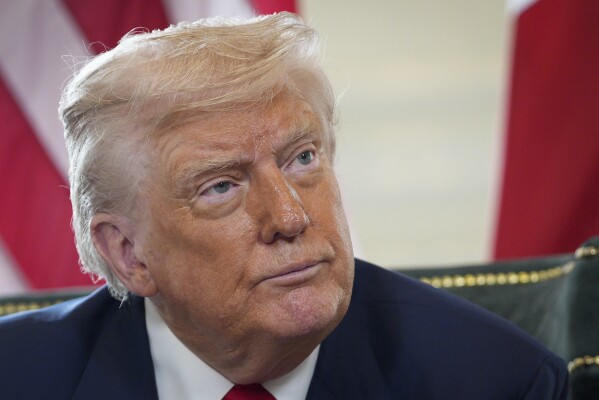 U.S. President Donald Trump talks to the media as he meets with British Prime Minister Keir Starmer at Trump Turnberry golf club in Turnberry, Scotland, Monday, July 28, 2025. (Christopher Furlong/Pool Photo via AP)