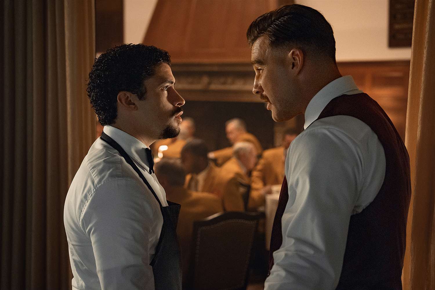 Benito Antonio Martínez Ocasio as Oscar Mejias and Travis Kelce as The Waiter in Happy Gilmore 2
