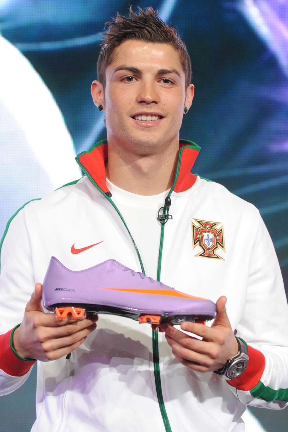 Cristiano Ronaldo holds a Nike Mercurial Vapor Superfly II football boot during a Nike press conference on February 24, 2010 in London.