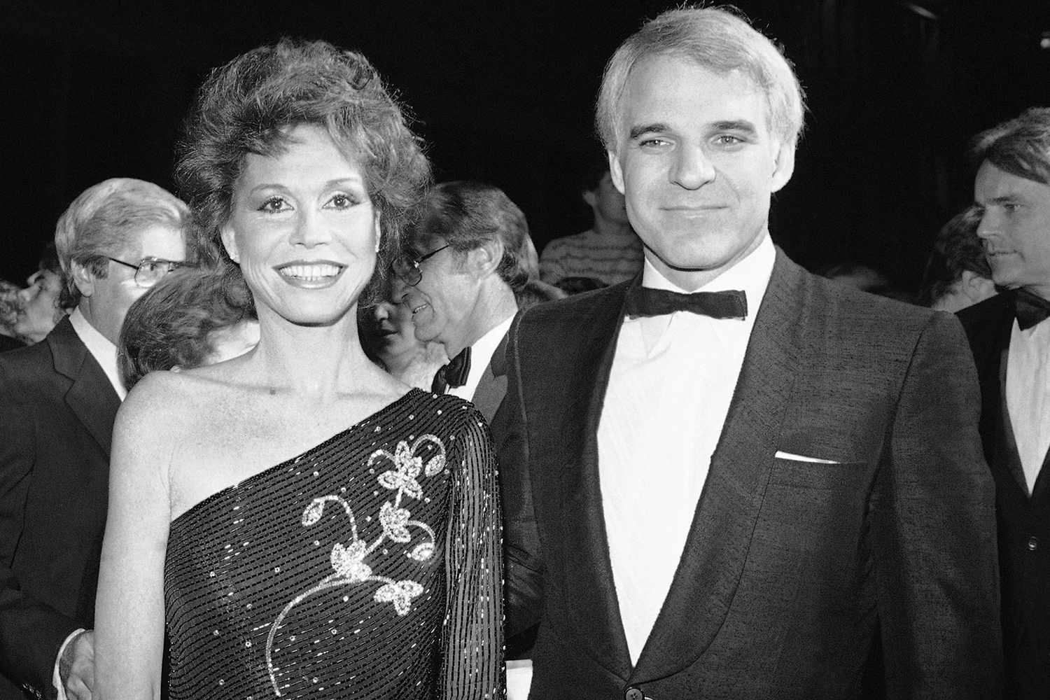 Actress Mary Tyler Moore, one of the stars of the new film ?Six Weeks? from Universal, smiles as she arrives at the film?s charity premiere with guest Steve Martin, Monday, Dec. 7, 1982 in Los Angeles.