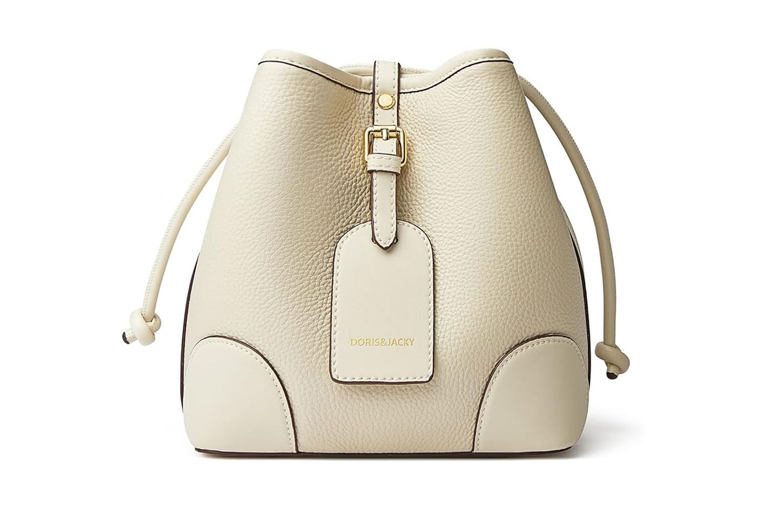 A small leather bucket crossbody bag with a drawstring closure and tag