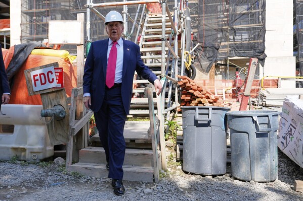 President Donald Trump visits the Federal Reserve during renovations, July 24, 2025, in Washington.