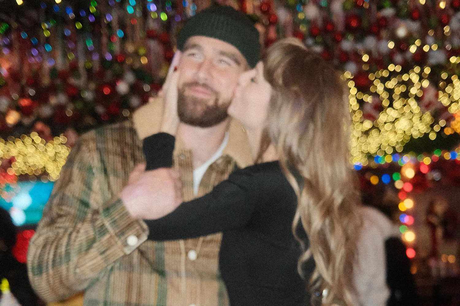 Taylor Swift Gives Travis Kelce a Sweet Kiss (working hed)