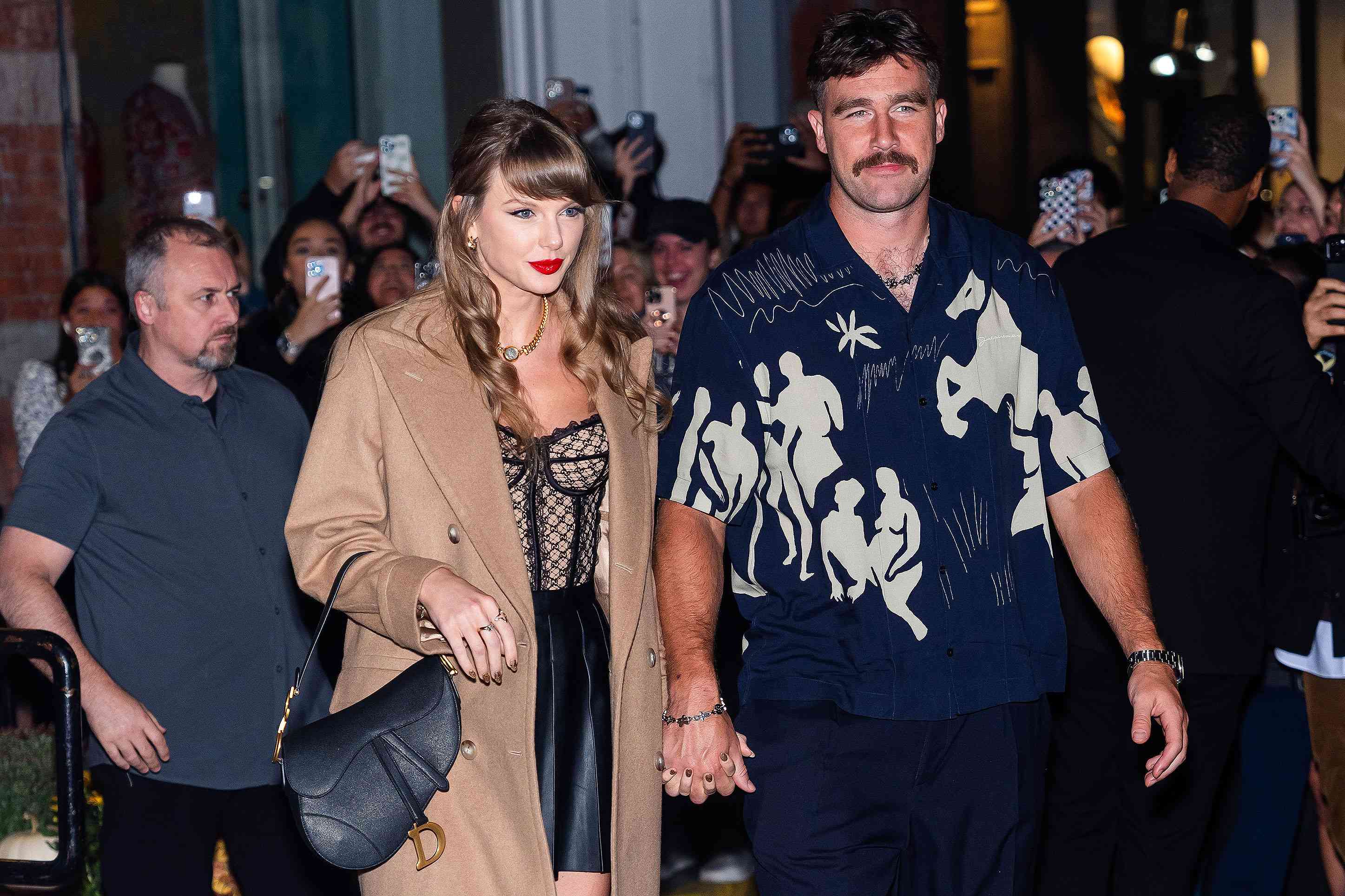 Taylor Swift (L) and Travis Kelce are seen in SoHo on October 11, 2024 in New York City.