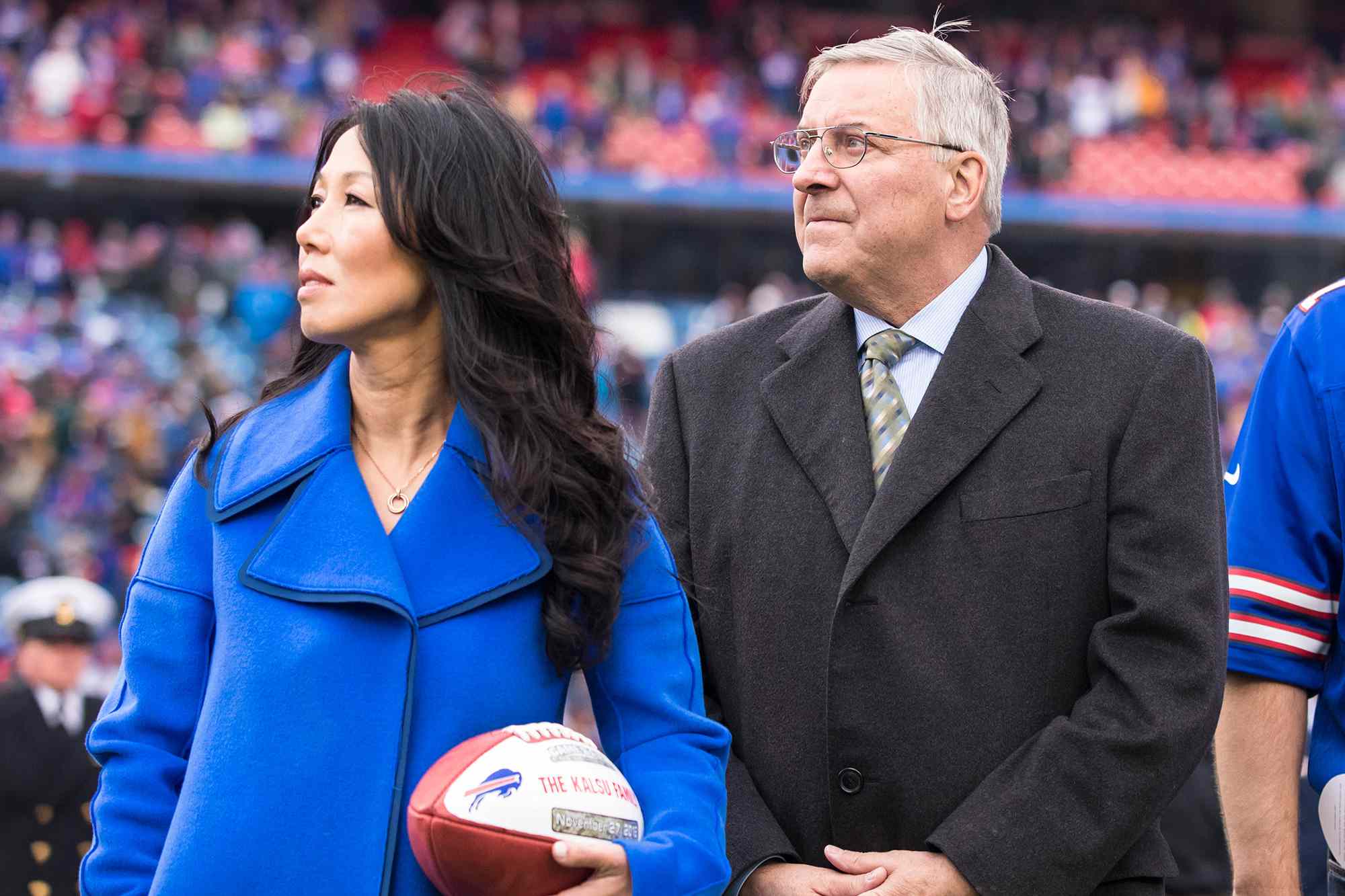 Buffalo Bills owners Kim and Terry Pegula honor the family of Buffalo Bills offensive lineman Bob Kalsu before the game on November 27, 2016.