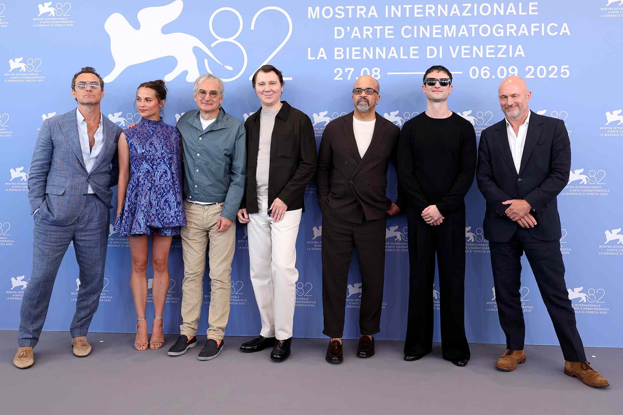 VENICE, ITALY - AUGUST 31: (L-R) Jude Law, Alicia Vikander, Olivier Assayas, Paul Dano, Jeffrey Wright, Tom Sturridge and Will Keen attend "The Wizard Of The Kremlin" (Le Mage Du Kremlin) photocall during the 82nd Venice International Film Festival on August 31, 2025 in Venice, Italy.