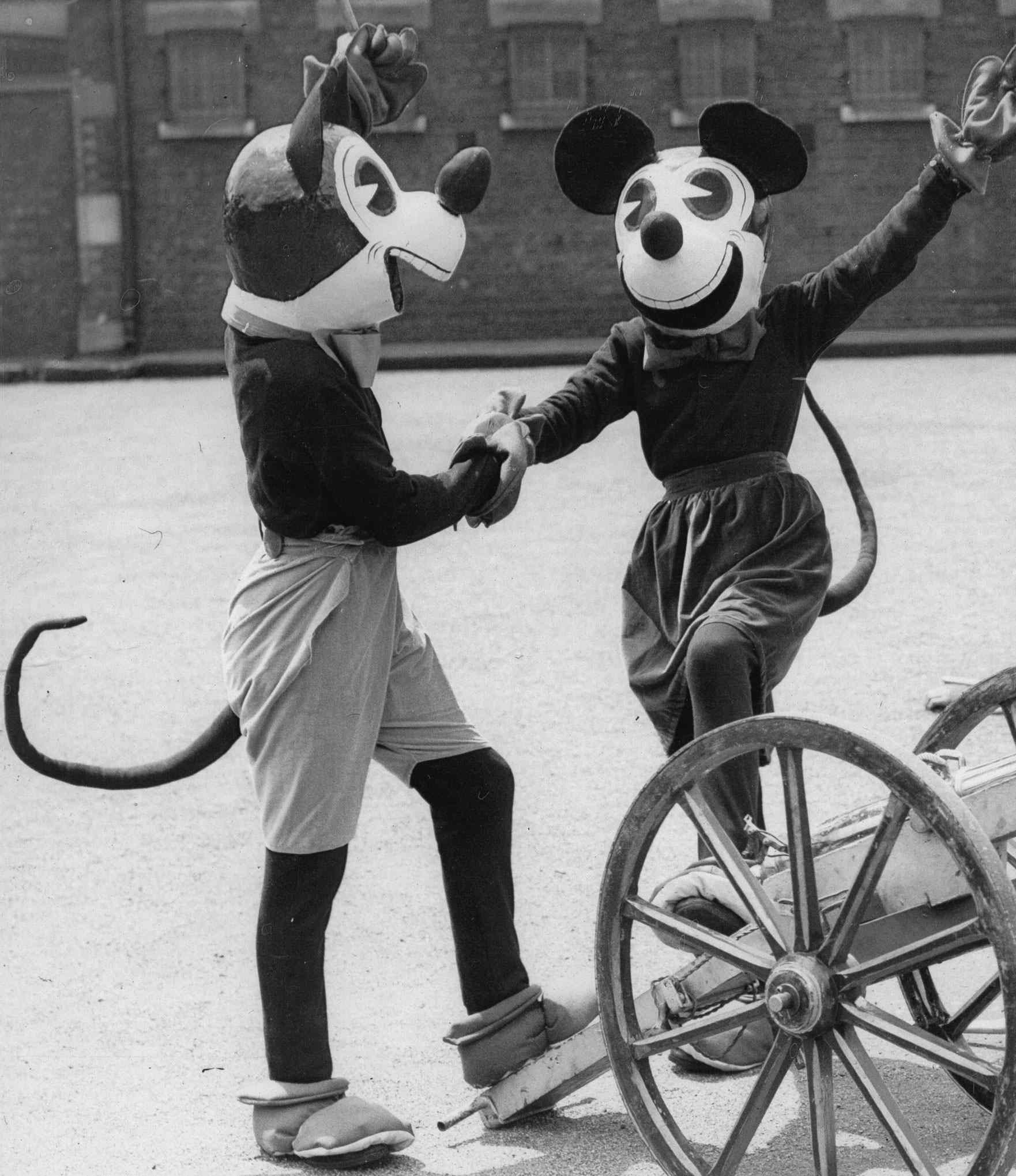 Mickey and Minnie Mouse and toy soldiers at Woolwich Searchlight Tattoo dress rehearsal