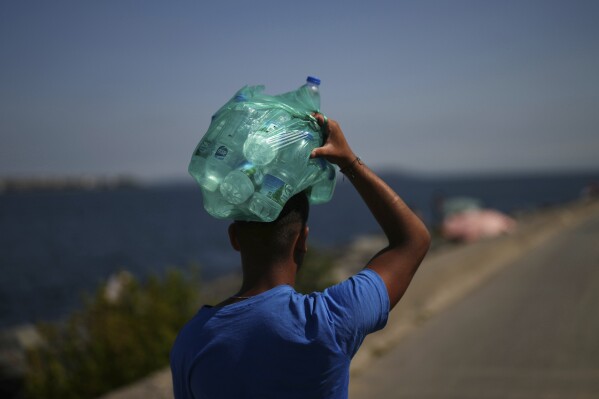 Street vendor carrying plastic bottles of water in Istanbul