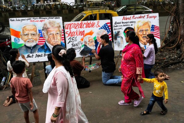 Students of Gurukul school of Art complete artwork of Donald Trump and Narendra Modi in Mumbai