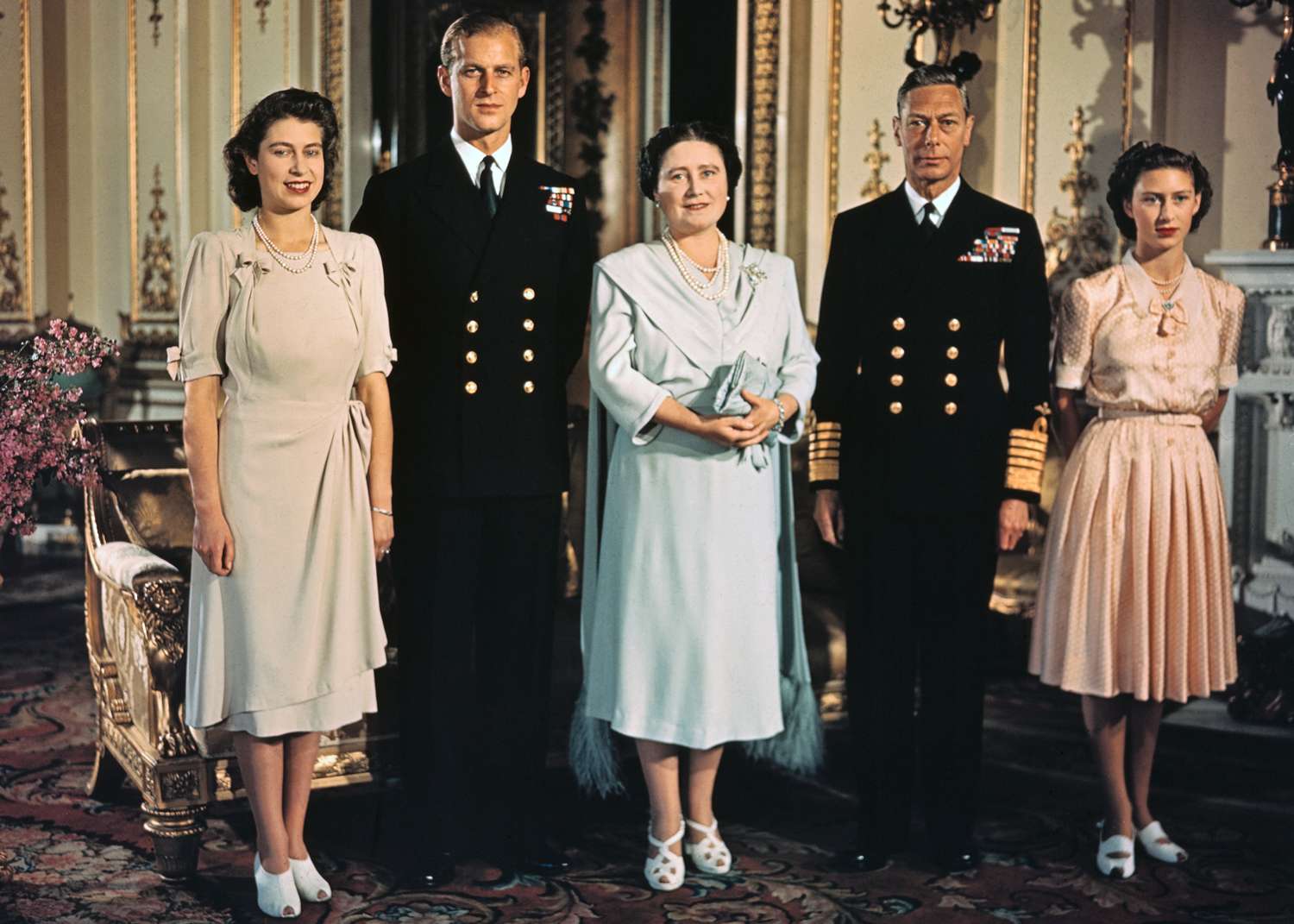 Princess Elizabeth, Lieutenant Philip Mountbatten, her then fiance, her mother, then Queen Elizabeth, now the Queen Mother, and her father, King George VI, in a family photograph made shortly before the Princess