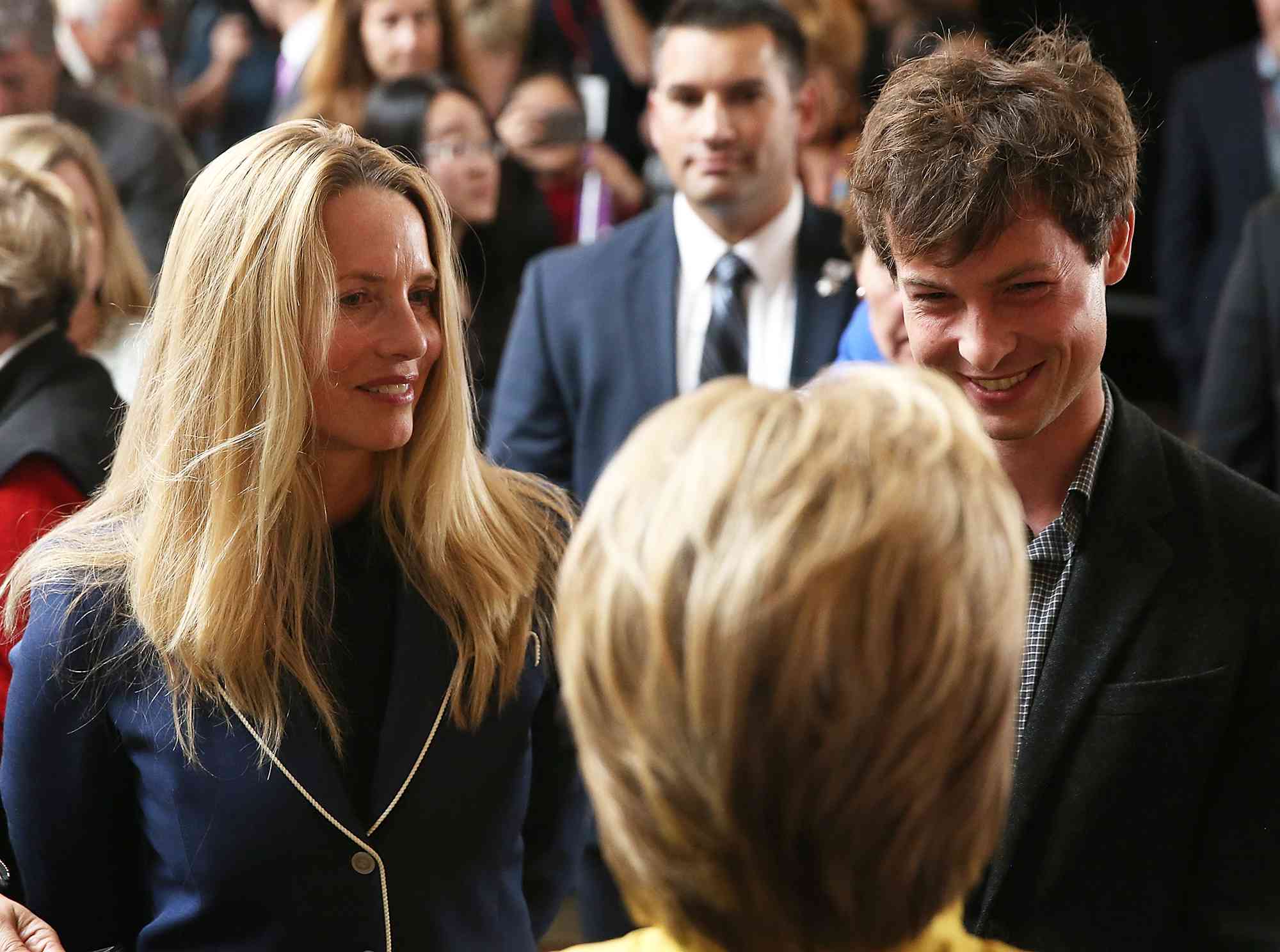 Hillary Clinton greets Laurene Powell and Reed Jobs