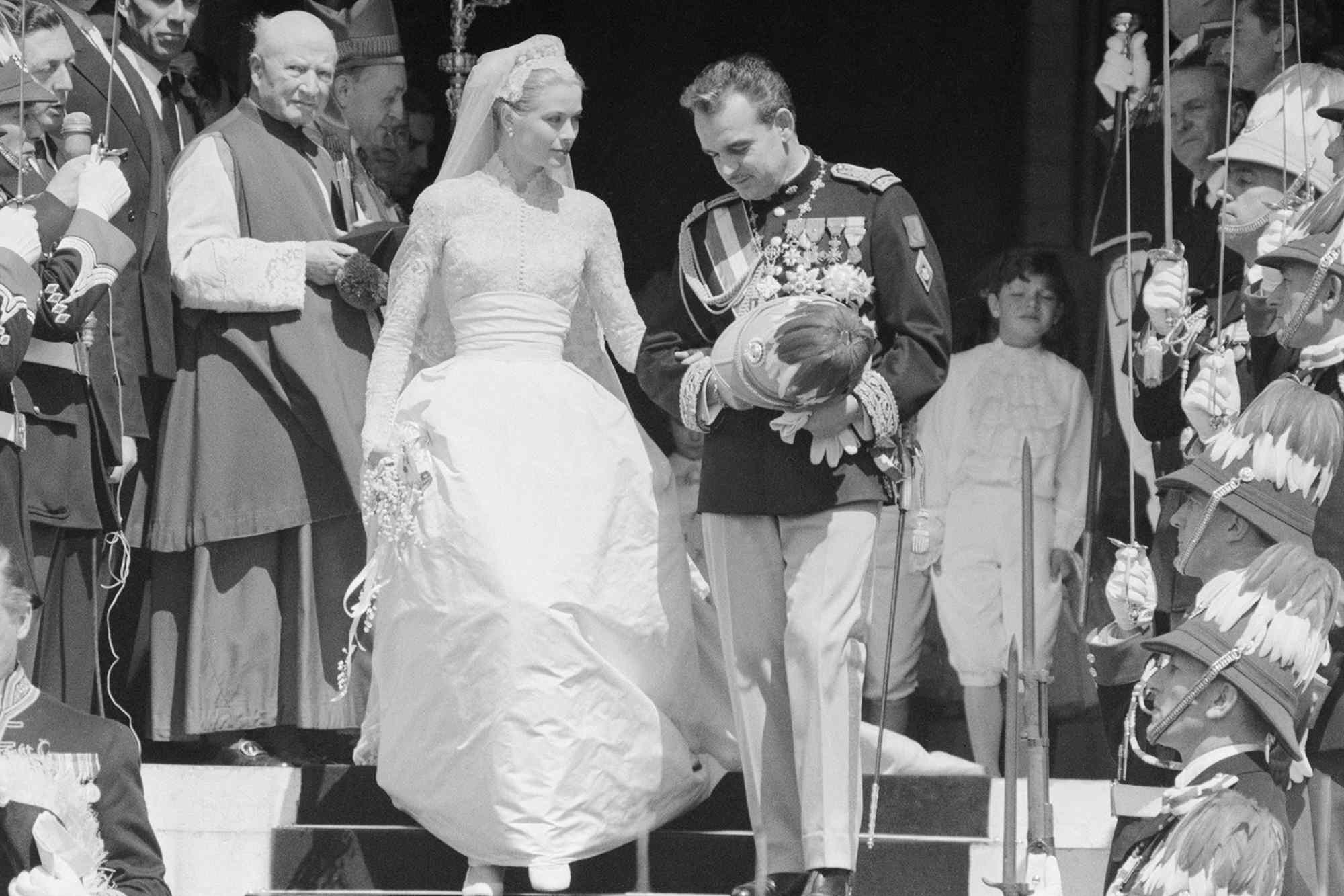 Grace Kelly and Prince Rainier of Monaco waving after their wedding