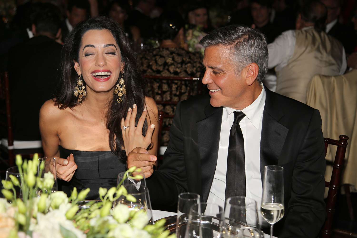 George Clooney (R) and fiance Amal Alamuddin attend the Celebrity Fight Night gala celebrating Celebrity Fight Night In Italy benefitting The Andrea Bocelli Foundation and The Muhammad Ali Parkinson Center on September 7, 2014 in Florence, Italy.