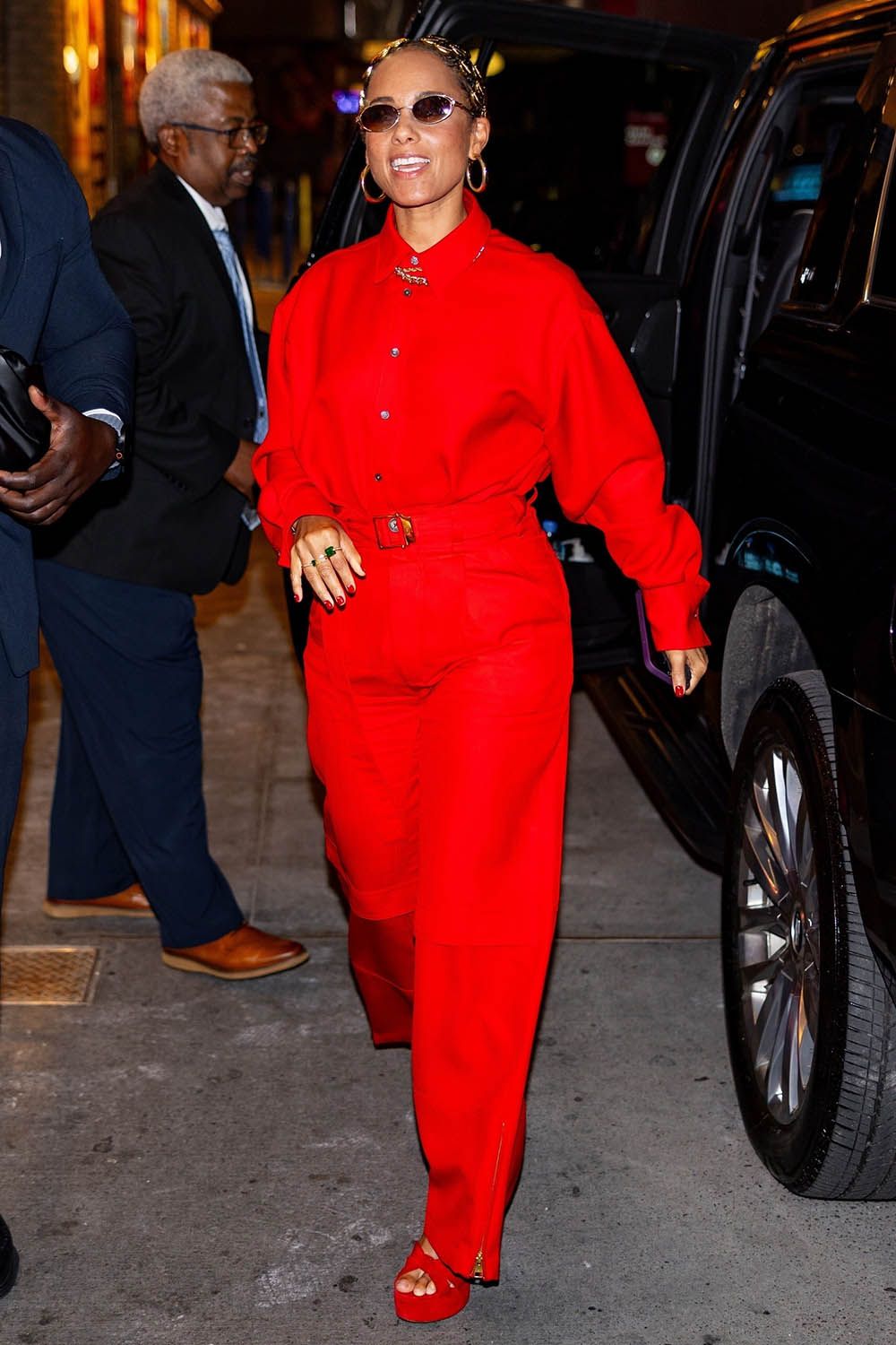 American singer-songwriter and classical pianist Alicia Keys was seen looking stunning in a red pantsuit as she took time to greet fans outside her Broadway musical Hell