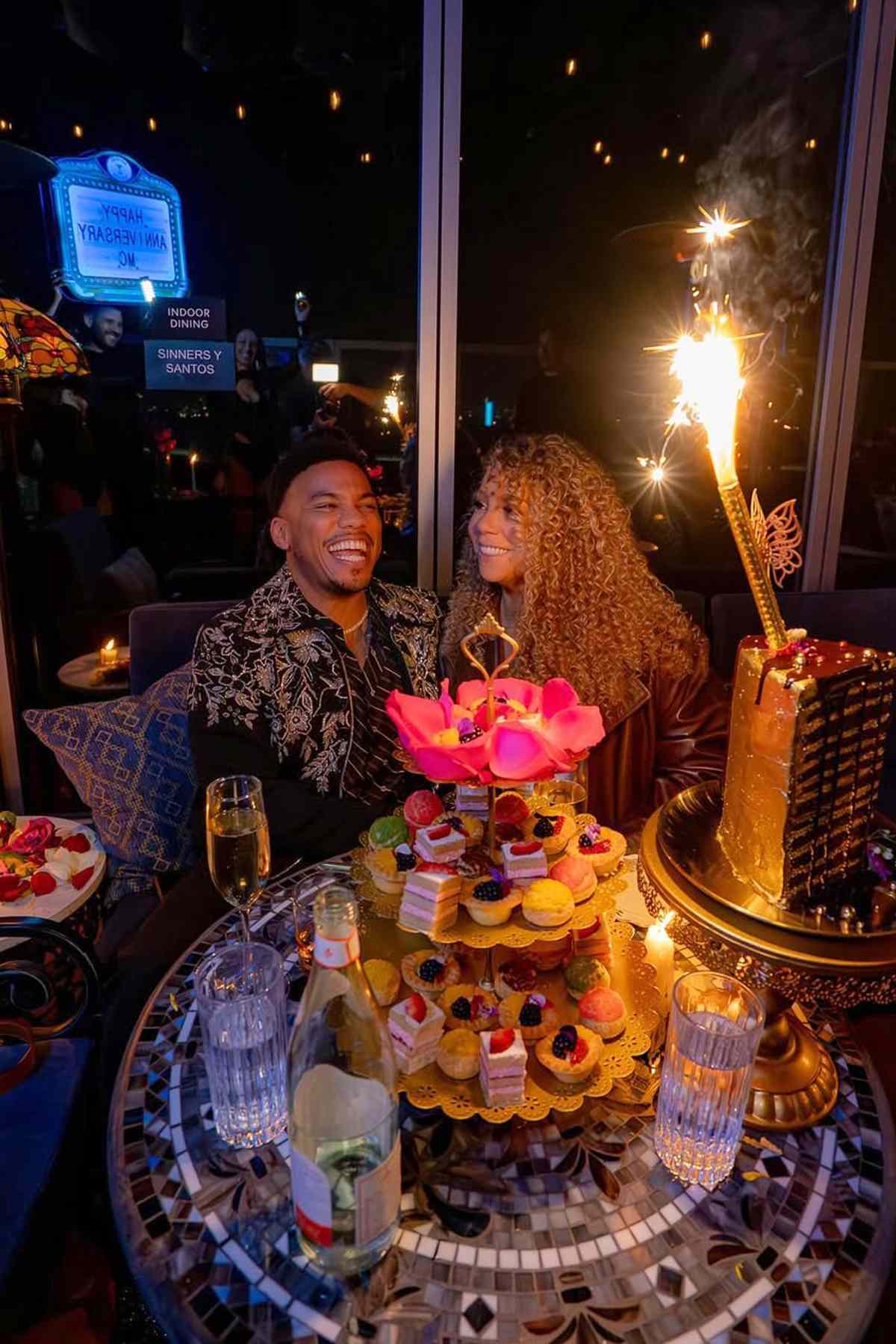Mariah Carey and Anderson .Paak holding hands after dinner