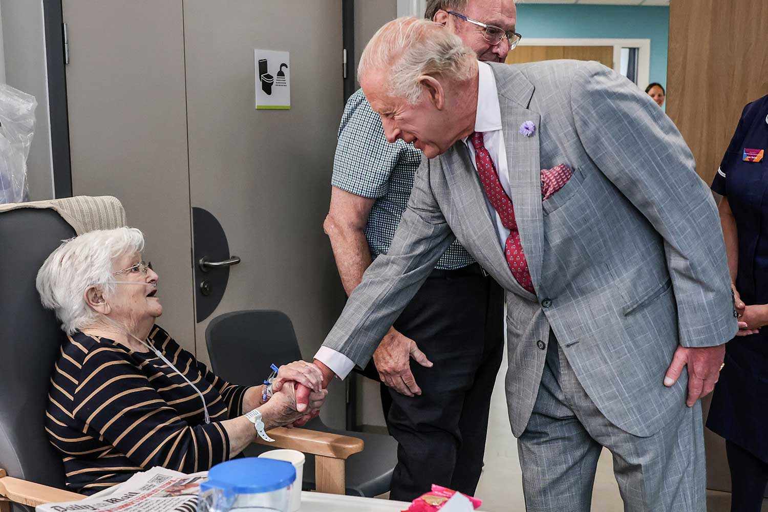 King Charles III talks with patient Jacqueline Page