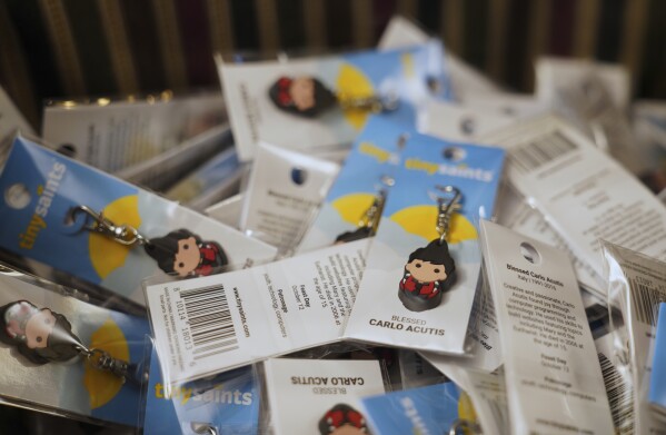 Blessed Carlo Acutis keychains sit outside the sanctuary of Blessed Carlo Acutis Parish during weekday Mass for the students of St. John Berchmans