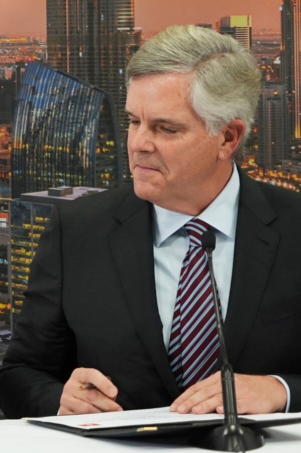 General Electric Co. CEO Lawrence Culp Jr. signs a $52 billion deal by Emirates to purchase Boeing aircraft with GE engines, at the Dubai Air Show, in Dubai, United Arab Emirates, Monday, Nov. 13, 2023.