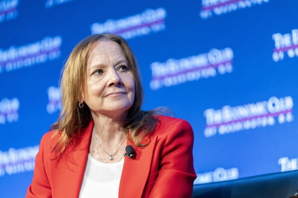 FILE- Mary Barra, chair and CEO of General Motors, talks to David Rubenstein during an interview hosted by the Economic Club of Washington, Wednesday, Dec. 13, 2023, in Washington.
