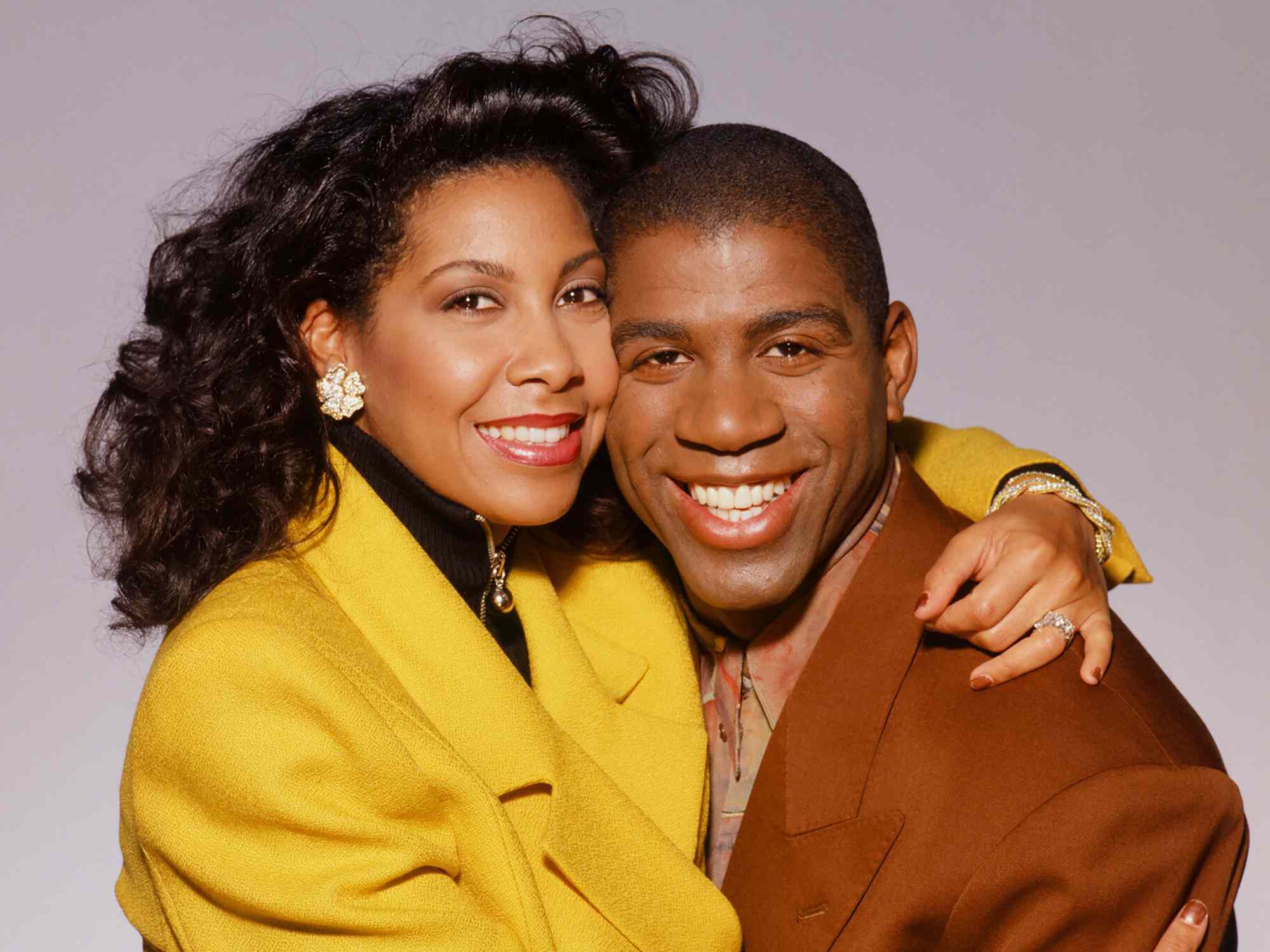 Magic Johnson & wife Cookie Johnson pose for a portrait in 1994