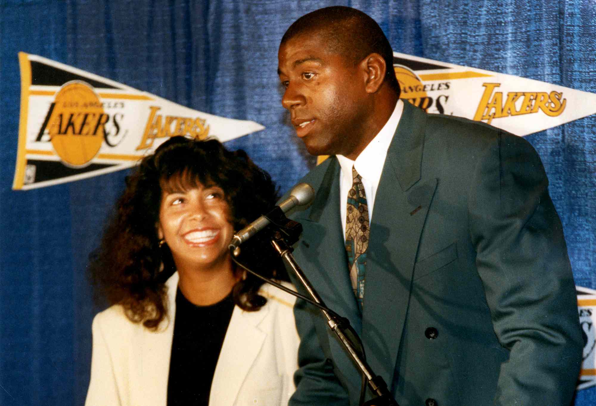 Earvin Magic Johnson introduced as head coach with wife Cookie looking on March 23, 1994