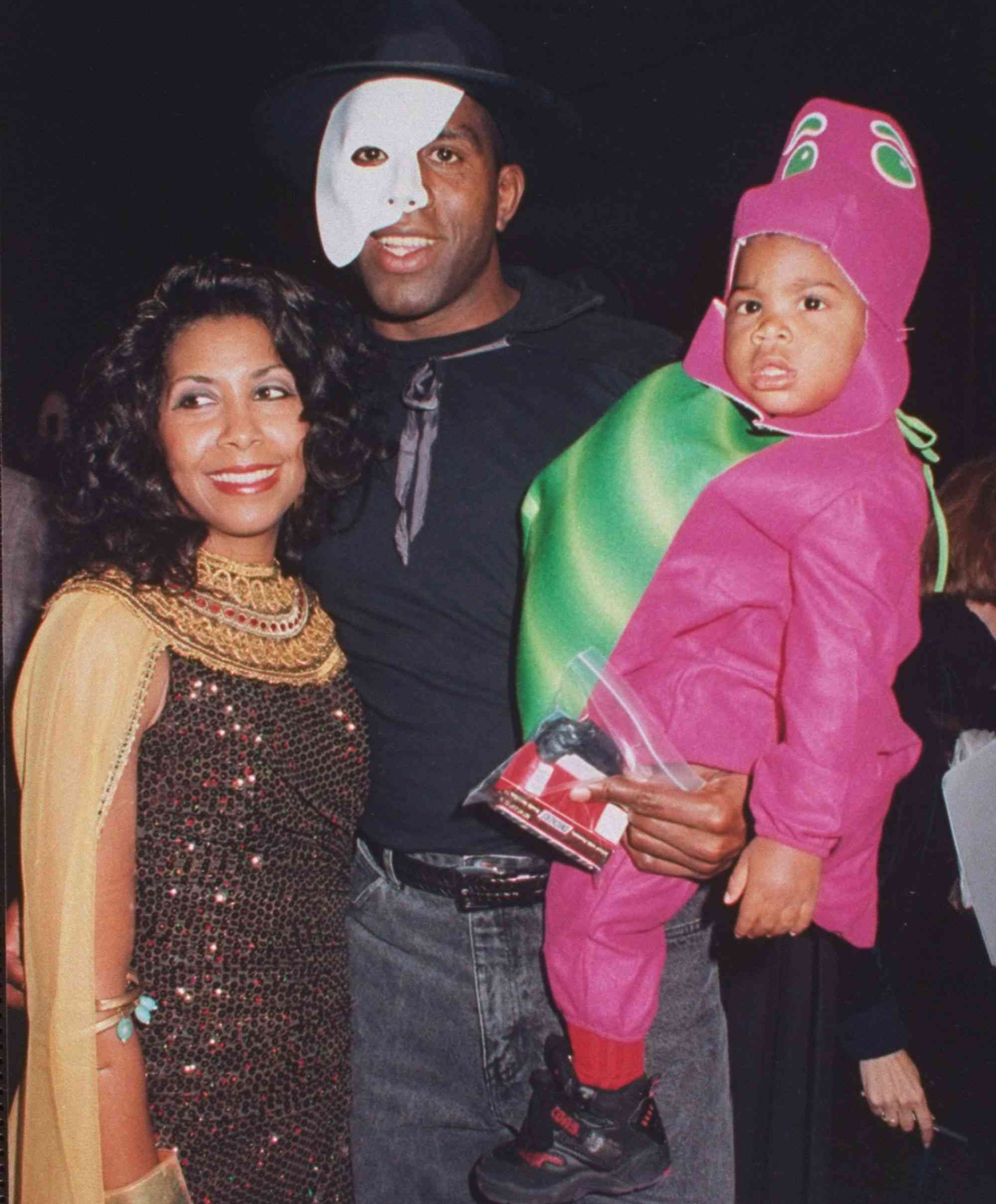 Magic Johnson, wife Cookie, and son Earvin III at Halloween AIDS fundraiser