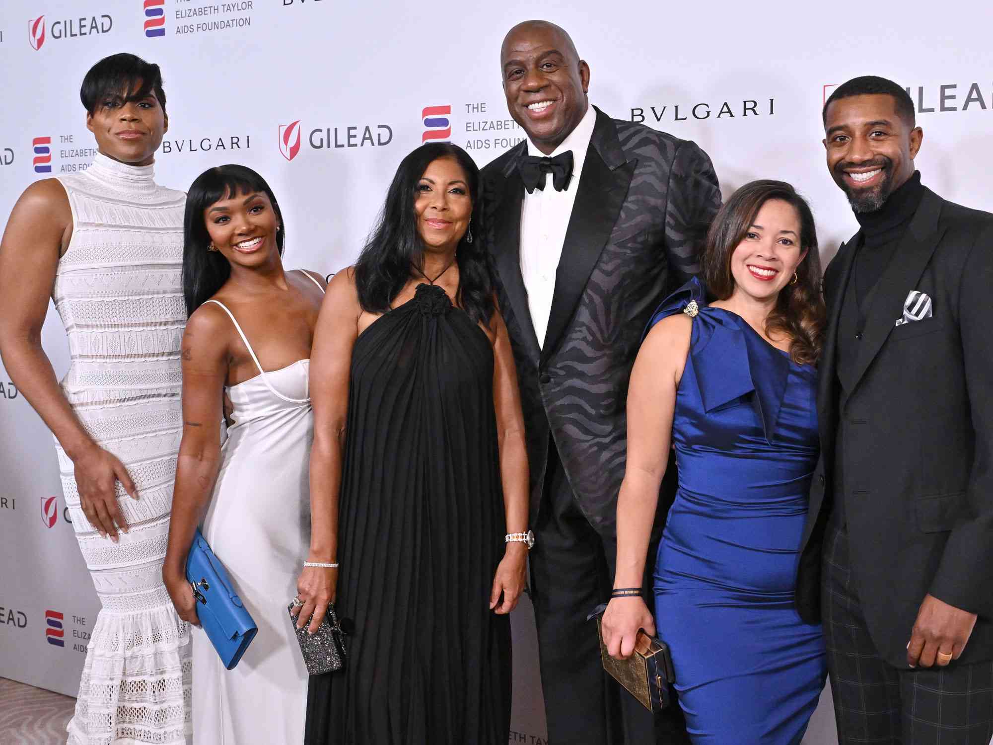 EJ Johnson, Elisa Johnson, Cookie Johnson, Magic Johnson, Lisa Johnson and Andre Johnson attend The Elizabeth Taylor Ball to End AIDS on September 21, 2023