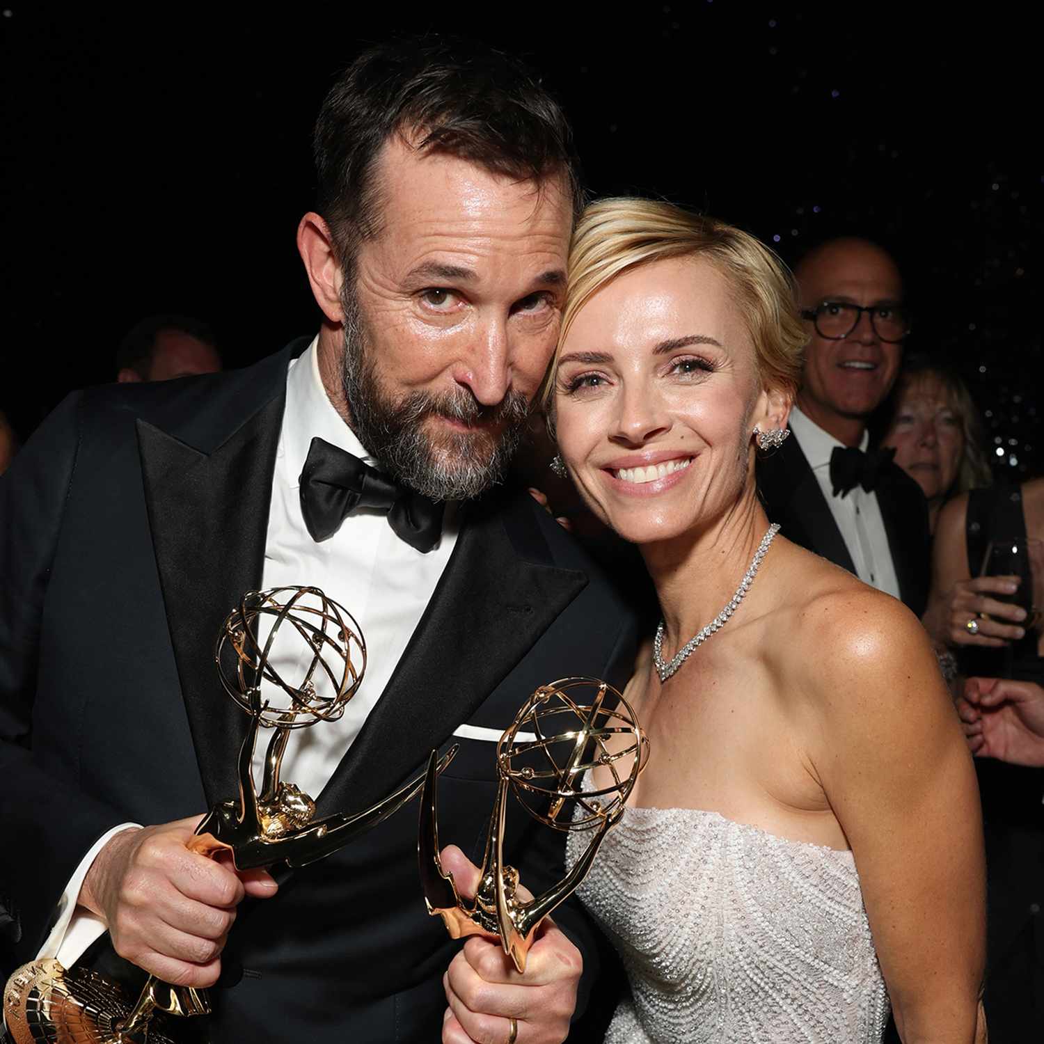 Noah Wyle, from left, and Sara Wells enjoy the 77th Emmy Awards Governors Gala