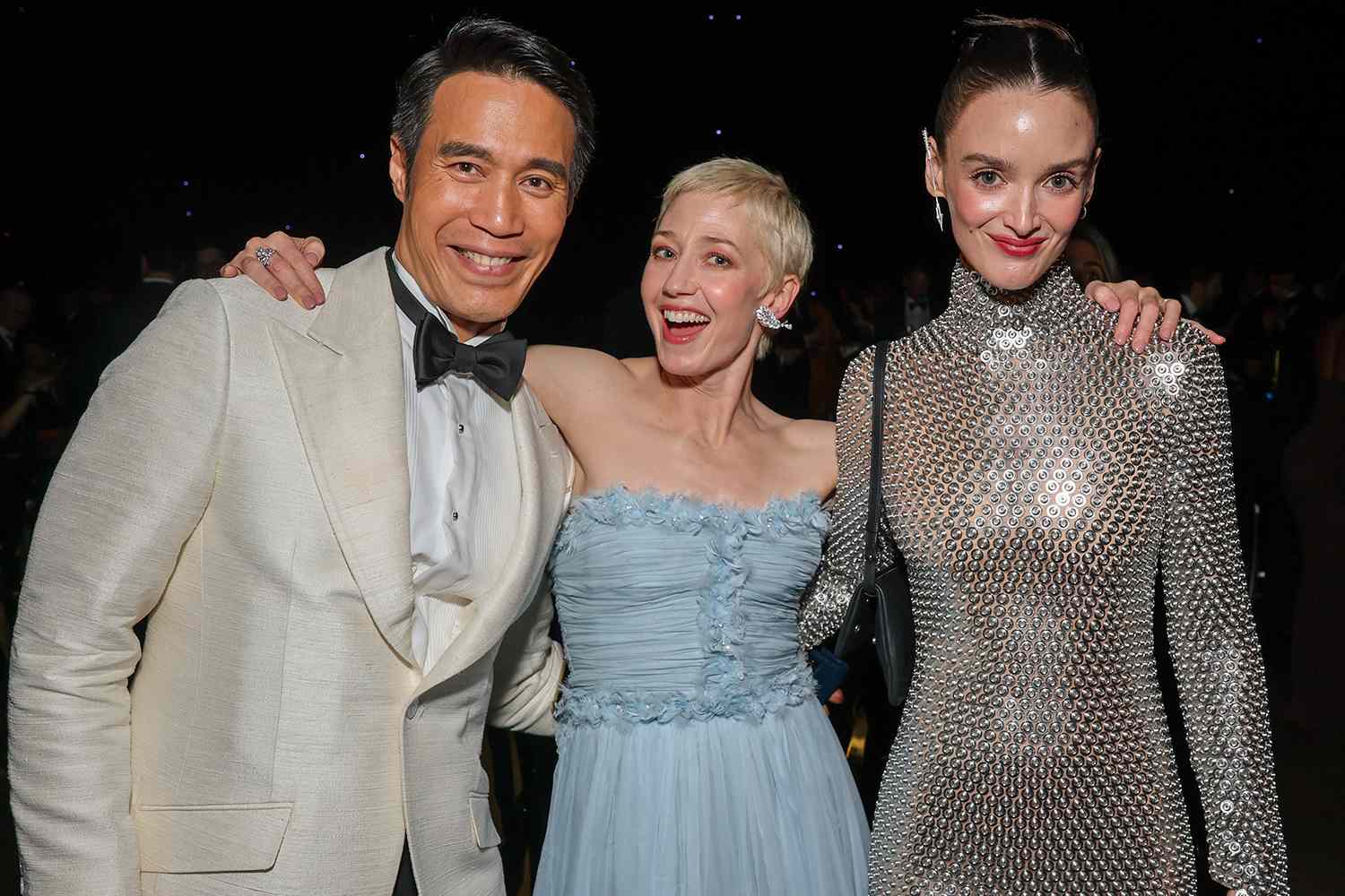 Dom Hetrakul, from left, Carrie Coon and Charlotte Le Bon enjoy the 77th Emmy Awards Governors Gala