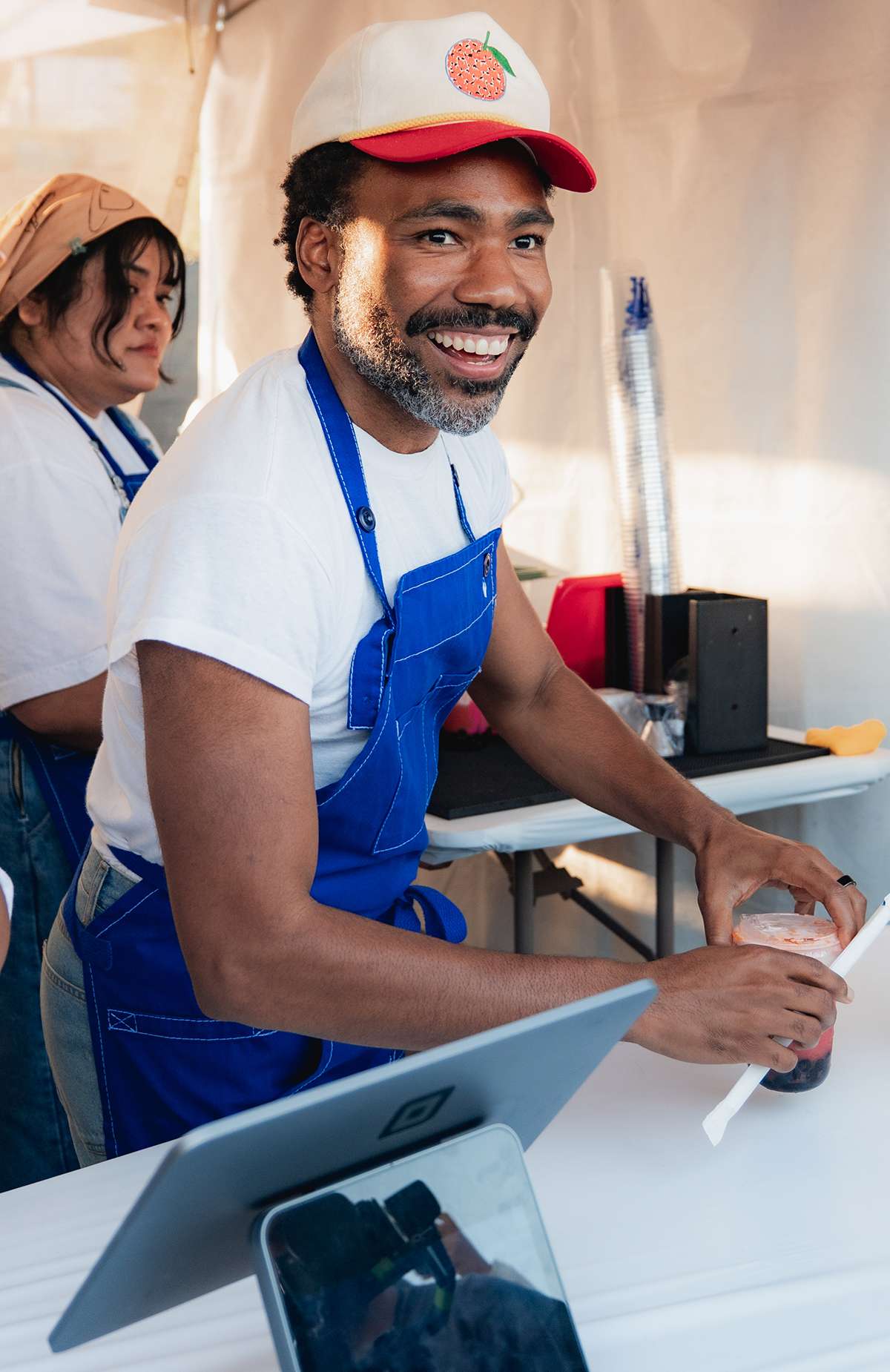 Donald Glover serves Jellyman Boba Tea during a special “Pink Hour” at Family Style Food Festival LA