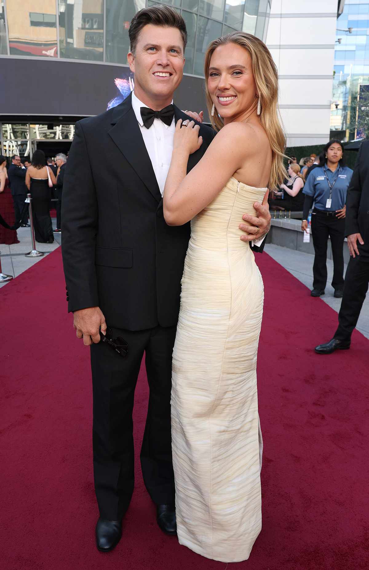 Colin Jost and Scarlett Johansson walk the red carpet at the 77th Emmy Awards