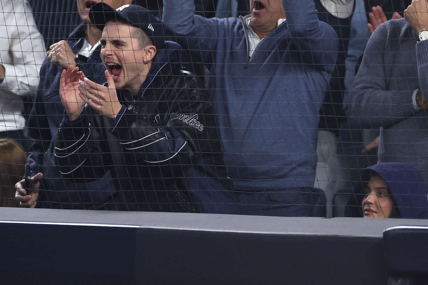 Timothée Chalamet cheers alongside Kylie Jenner during the fourth inning of game four of the American League Division Series between the New York Yankees and the Toronto Blue Jays at Yankee Stadium on October 08, 2025 in New York City.