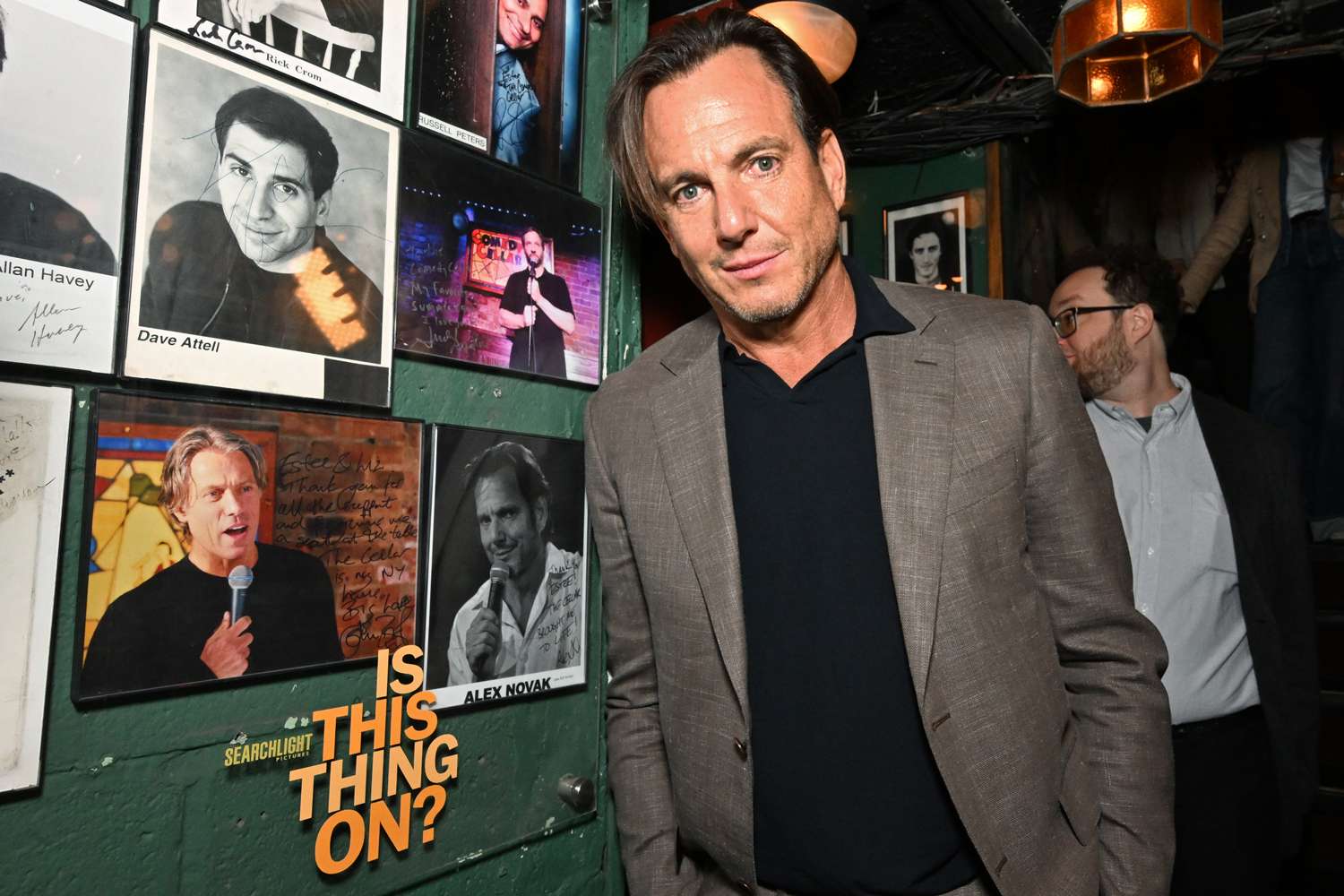 Will Arnett poses next to his stand-up photo at the "Is This Thing On" world premiere afterparty during the 