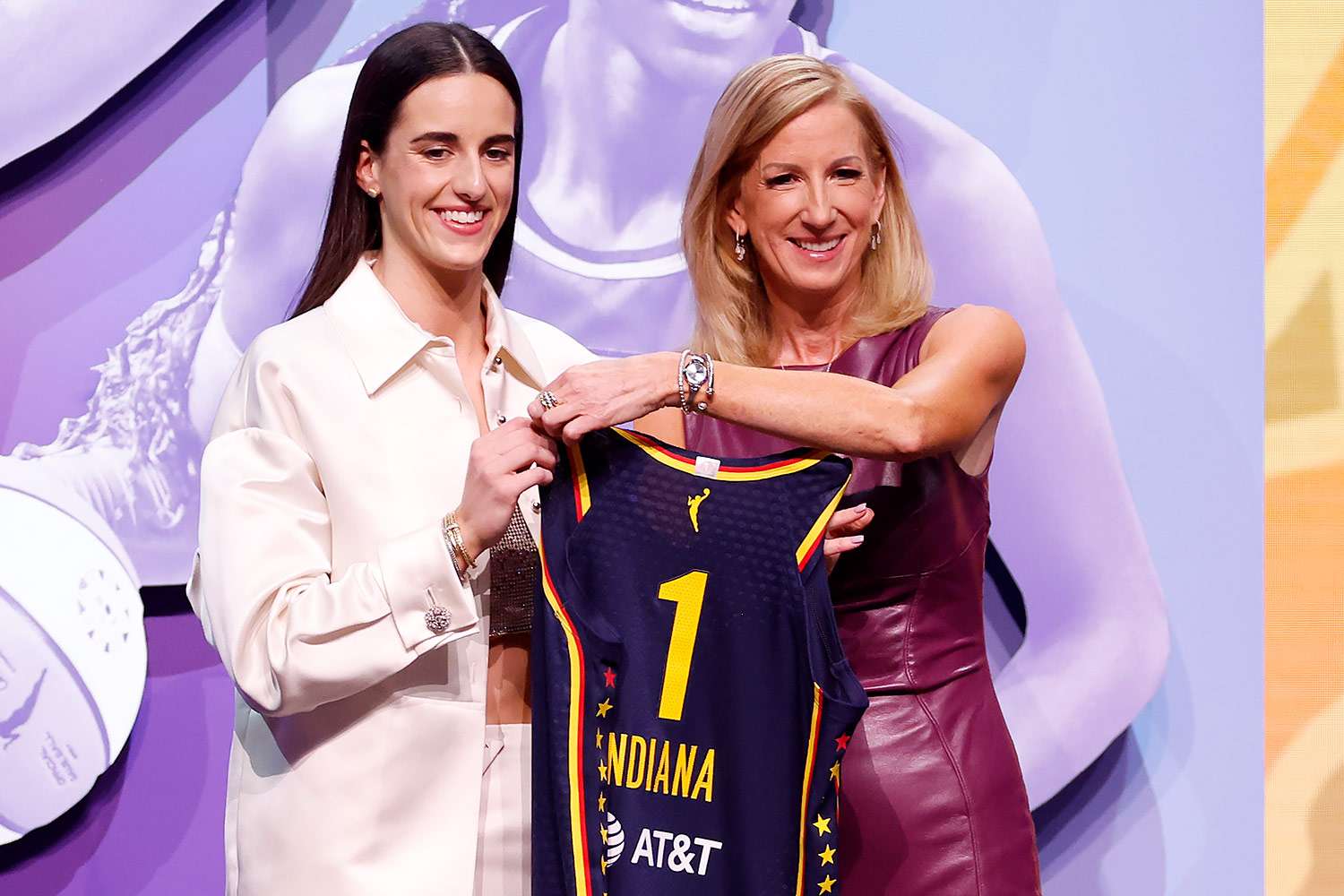 Caitlin Clark poses with WNBA Commissioner Cathy Engelbert after being selected first overall pick by the Indiana Fever during the 2024 WNBA Draft at Brooklyn Academy of Music on April 15, 2024 in New York City.