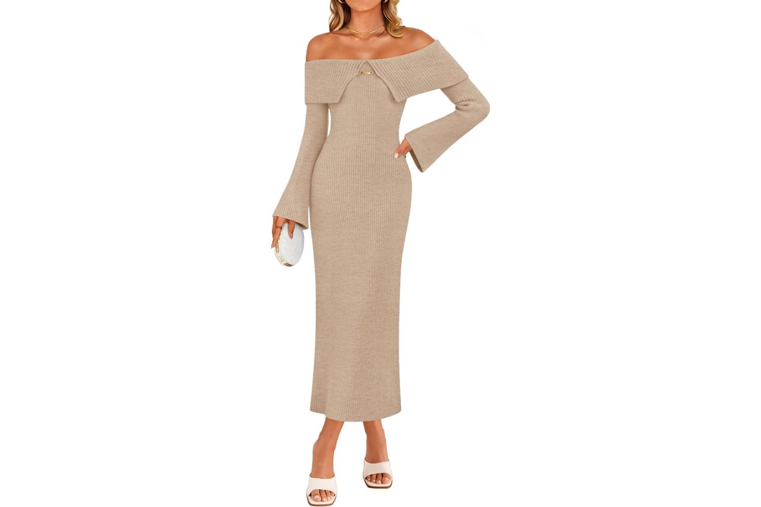 A person wearing an offshoulder sweater dress holding a clutch bag with heeled sandals