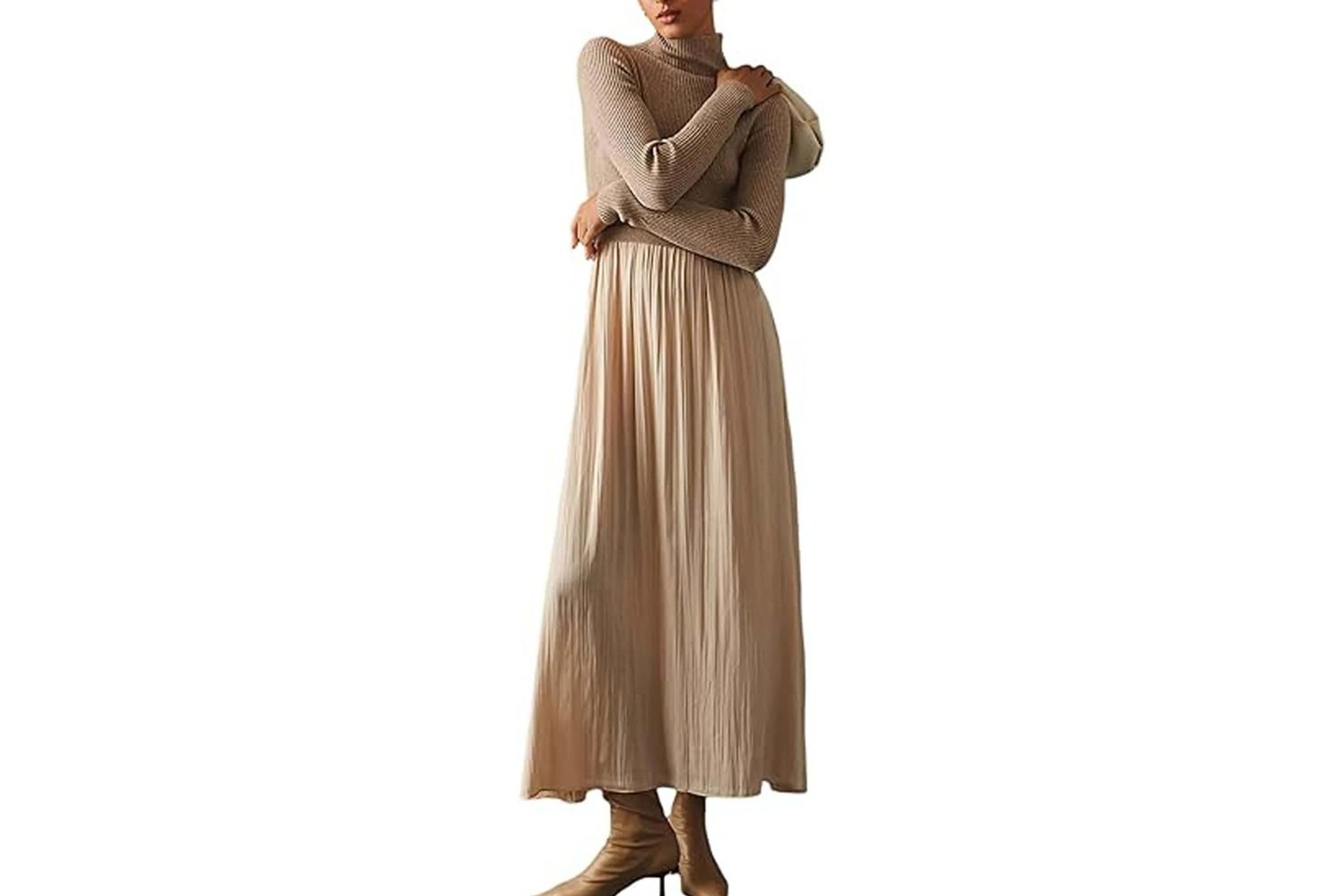 A person modeling a longsleeve turtleneck maxi sweater dress with a pleated skirt
