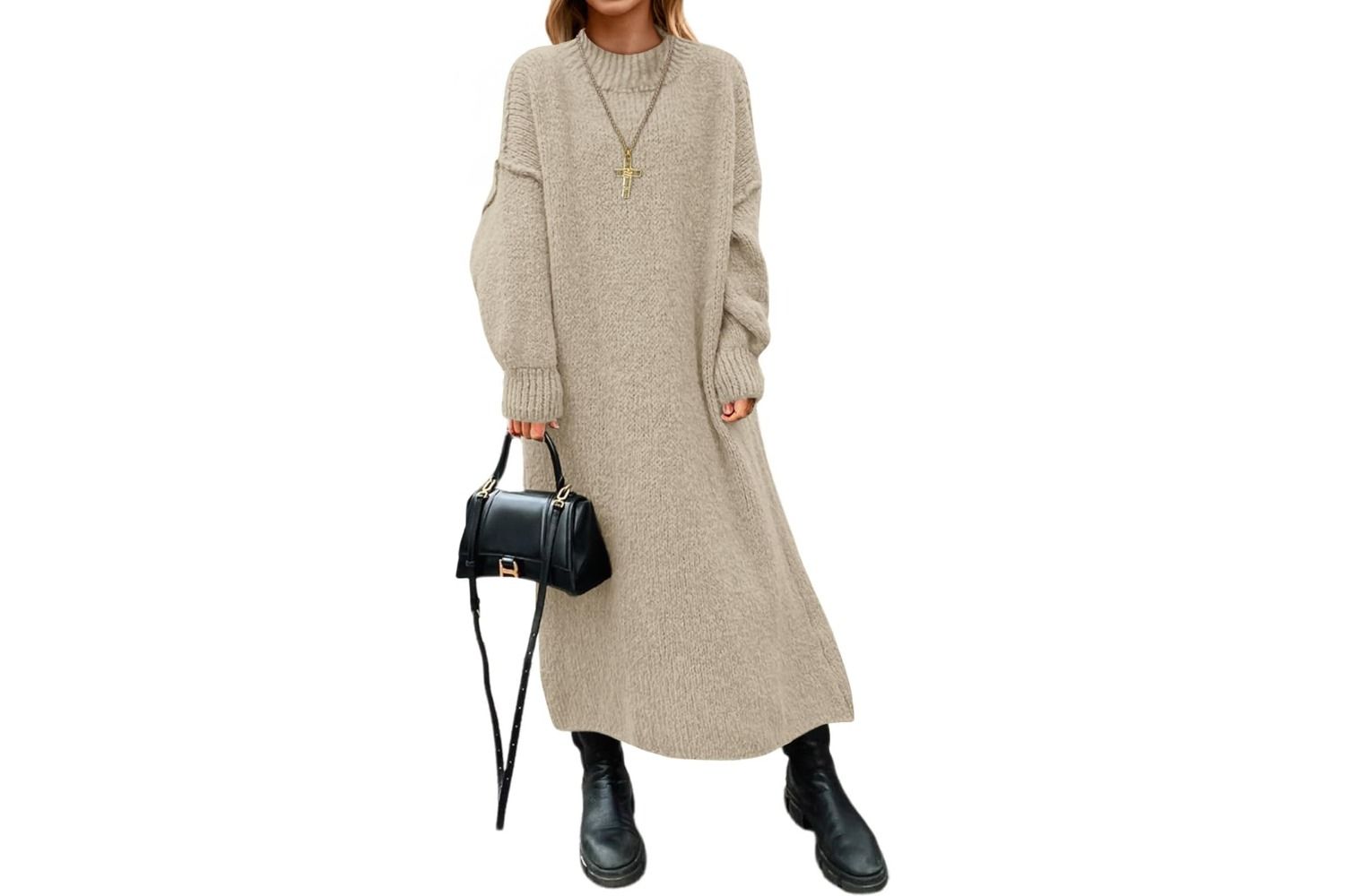 A person wearing a long sweater dress paired with boots and holding a small handbag