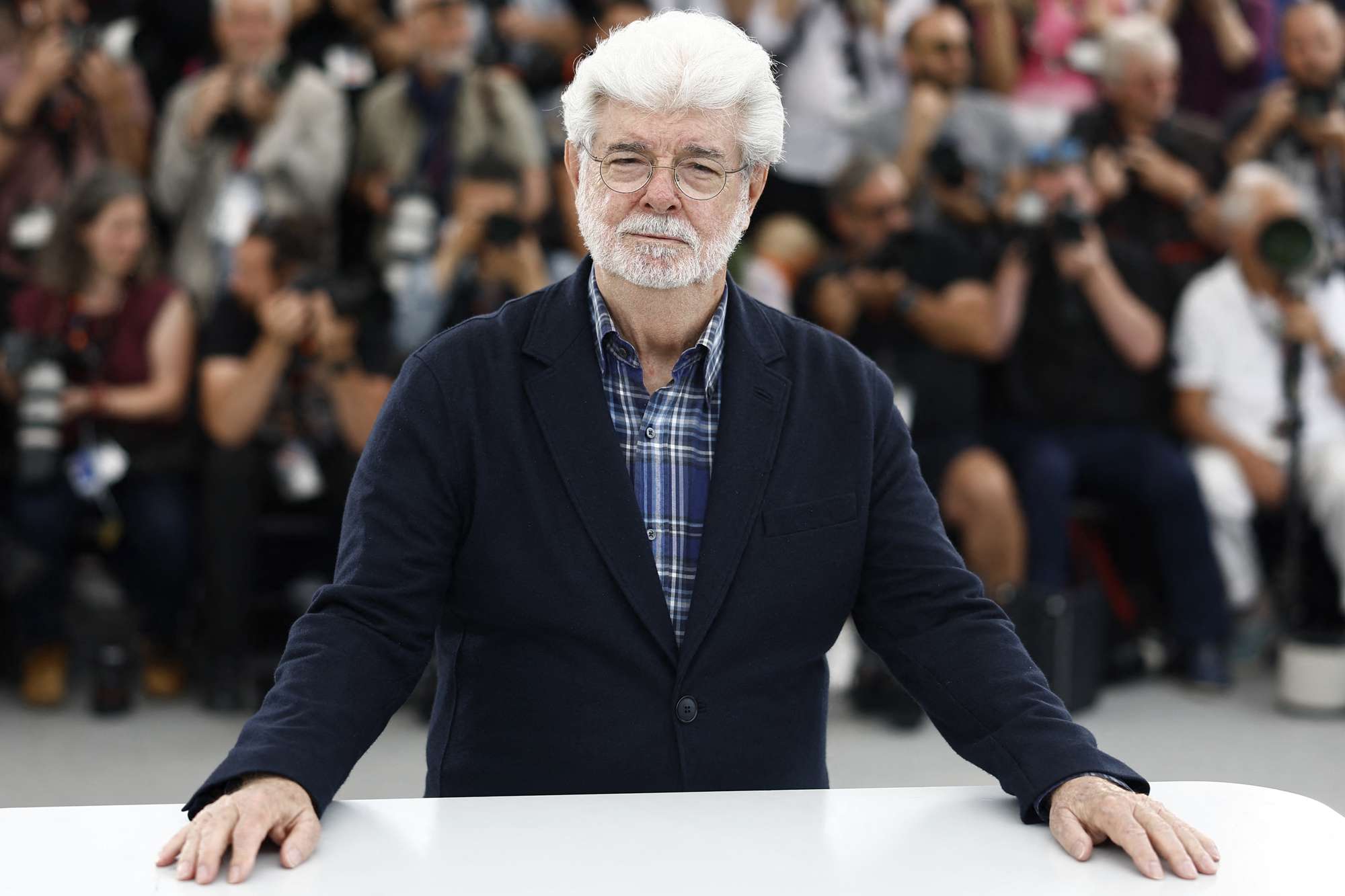 US director George Lucas poses during a photocall before receiving the Honorary Palme d