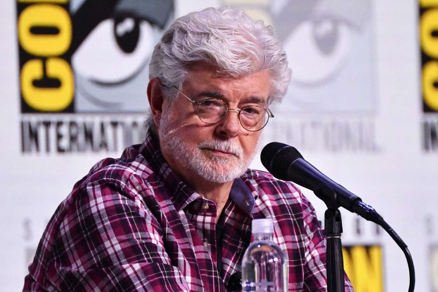 US filmmaker George Lucas speaks during the Sneak Peek of the Lucas Museum of Narrative Art panel in Hall H of the convention center during Comic Con International in San Diego, California on July 27, 2025.