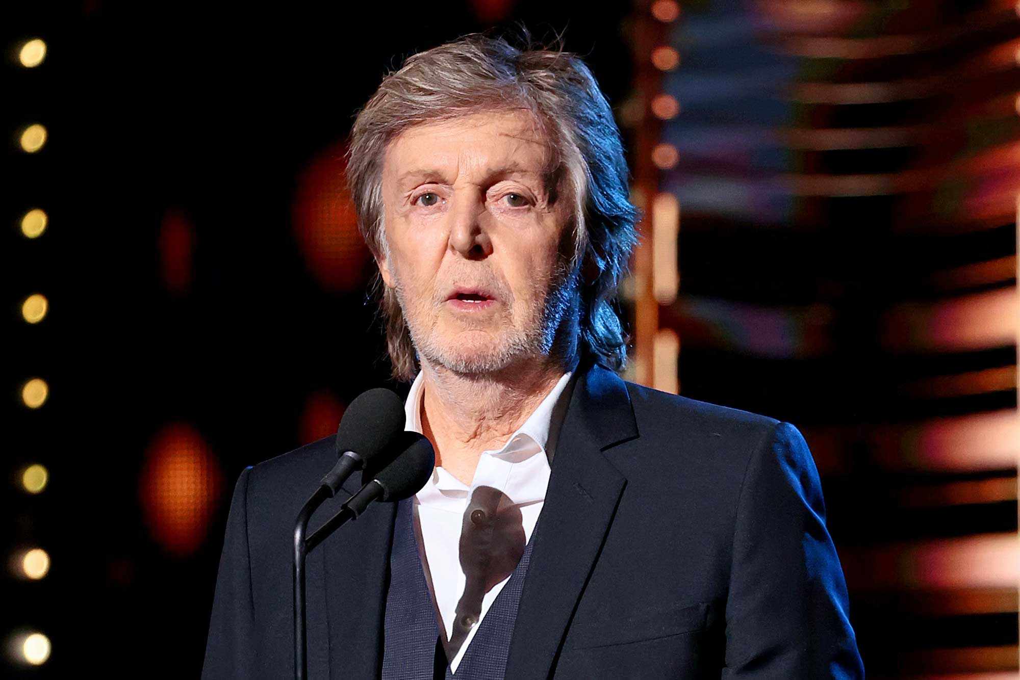 Paul McCartney speaks onstage