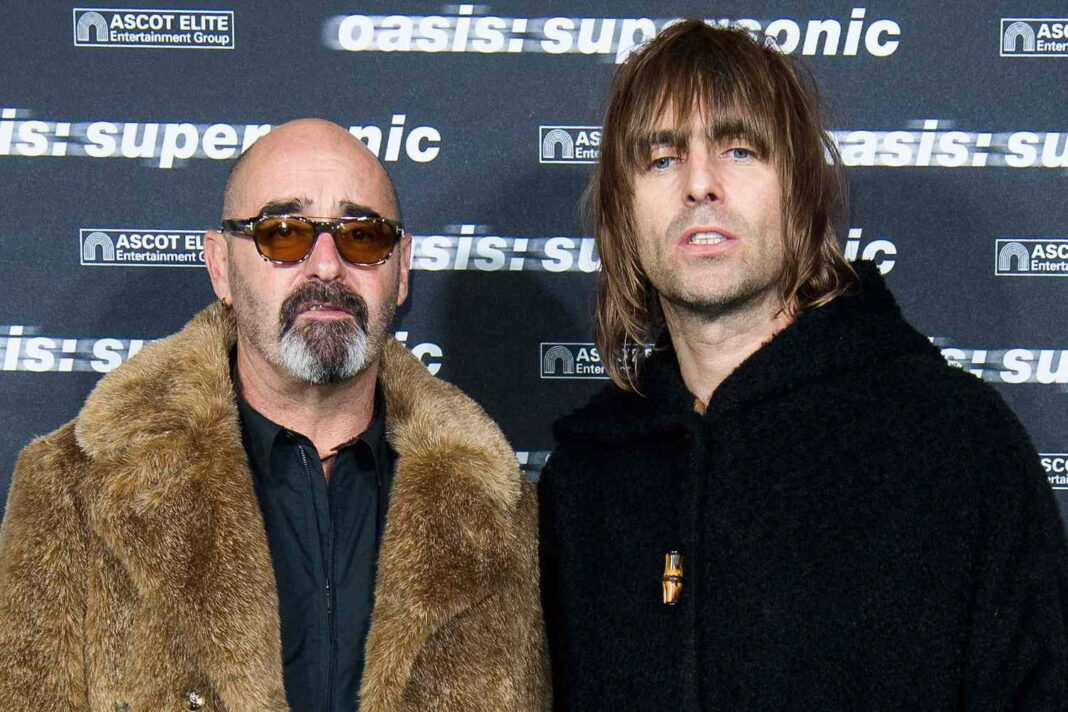 Oasis Guitarist Paul ‘Bonehead’ Arthurs Steps Away From Reunion Tour Amidst Prostate Cancer Battle
