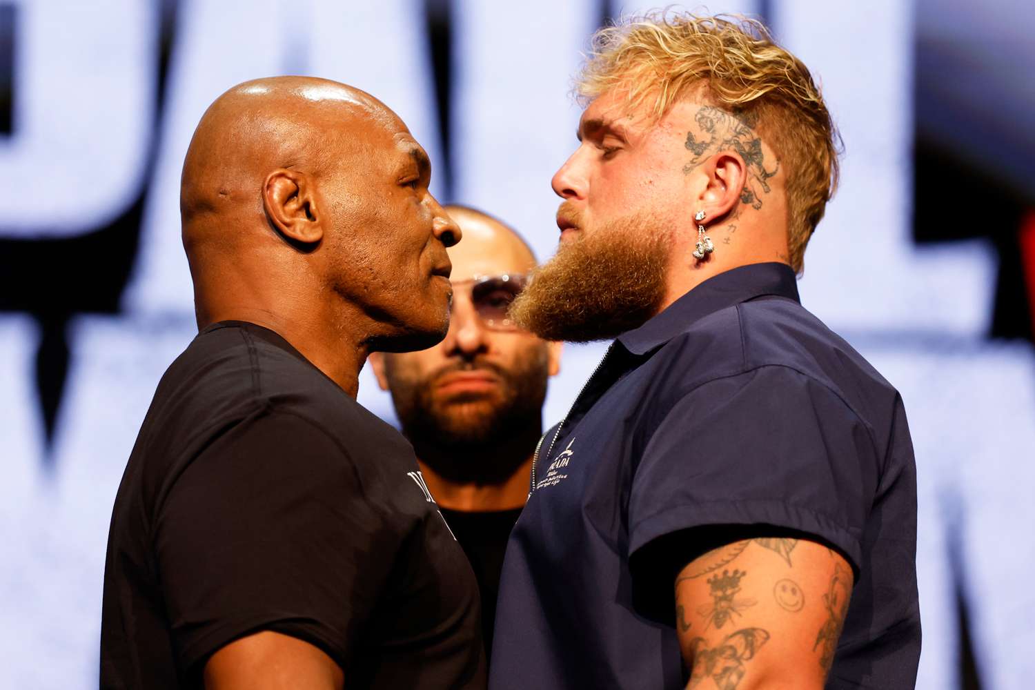 Mike Tyson and Jake Paul speak onstage at the press conference in promotion for their upcoming boxing match at The Apollo Theater in New York City on May 13, 2024.