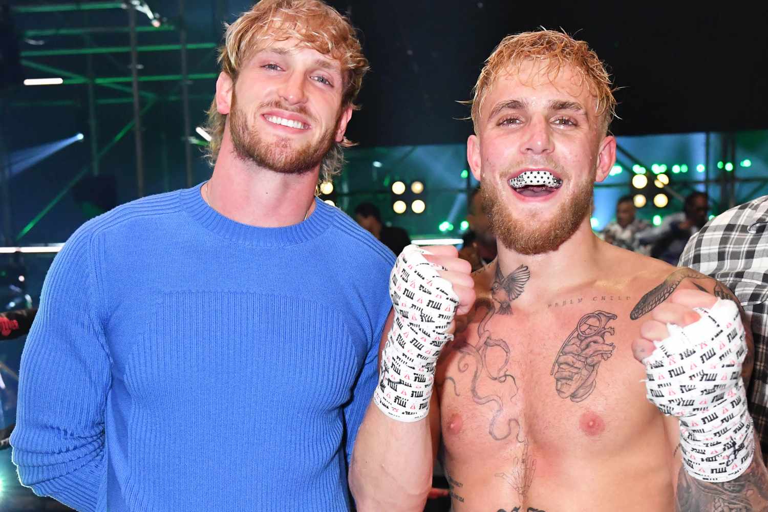 (L to R): Brothers Logan and Jake Paul pose together after Jake defeats Ben Askren during Triller Fight Club: Jake Paul vs. Ben Askren at Mercedes-Benz Stadium in Atlanta on April 17, 2021.