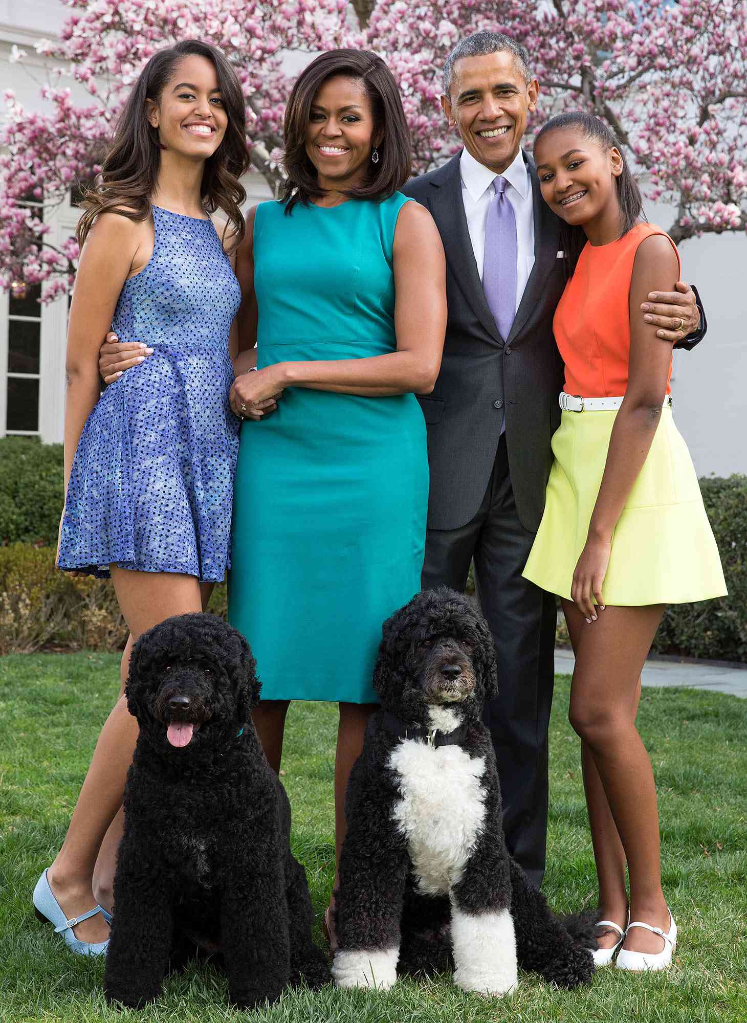 From left to right: Malia Obama, Barack Obama, Michelle Obama and Sasha Obama pose for a family portrait with their dogs, Sunny and Bo, outside of the White House on April 5, 2015