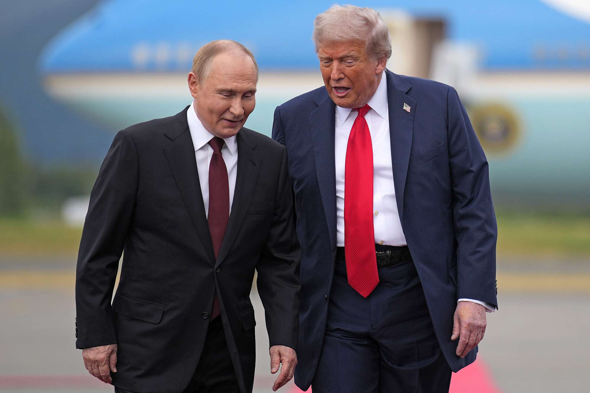 U.S. President Donald Trump (R) walks with Russian President Vladimir Putin as they arrived at Joint Base Elmendorf-Richardson on August 15, 2025 in Anchorage, Alaska. The two leaders are meeting for peace talks aimed at ending the war in Ukraine.