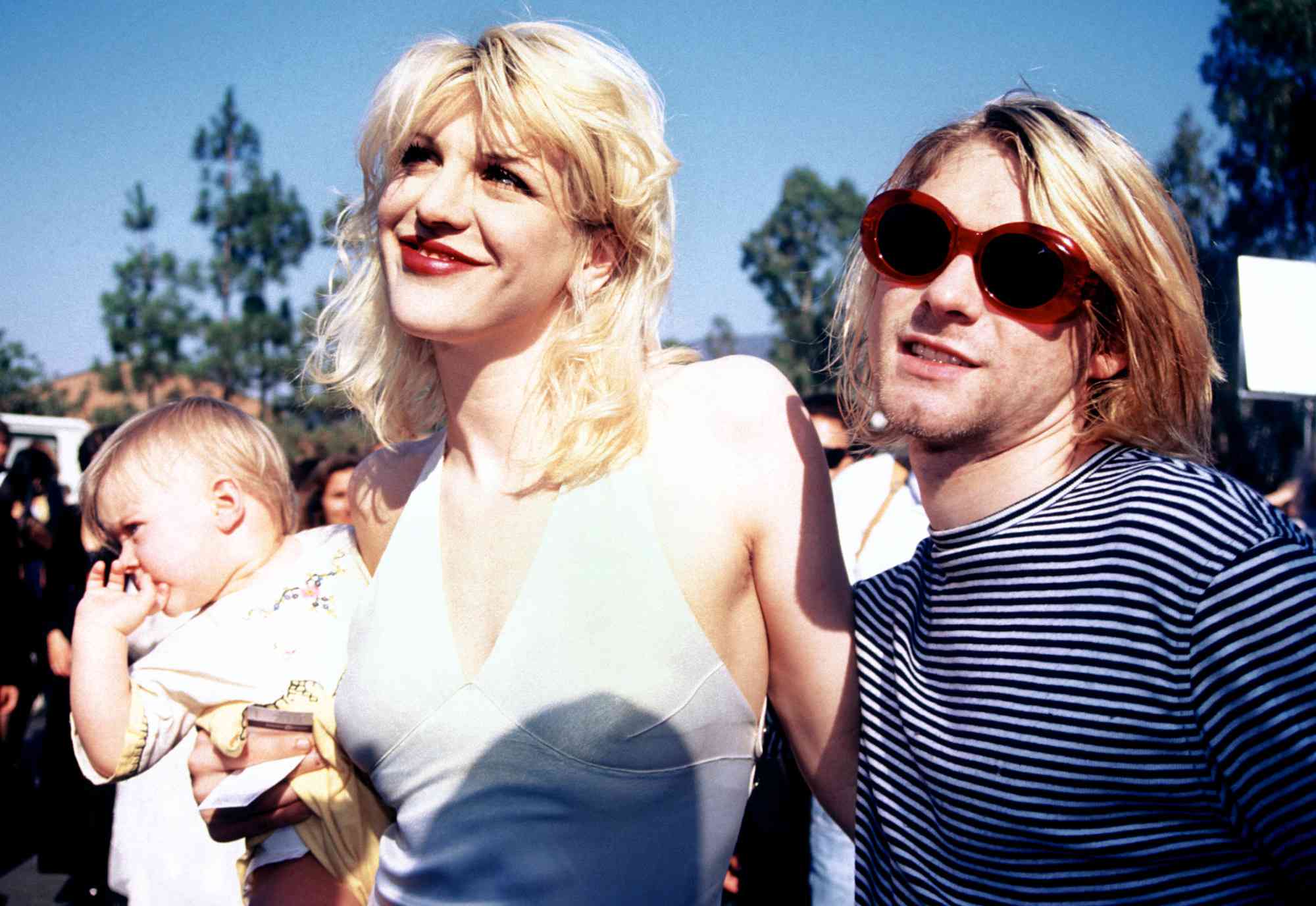 Kurt Cobain, Courtney Love, and Francis Bean attending the 1993 MTV Music Video Awards on September 2, 1993.