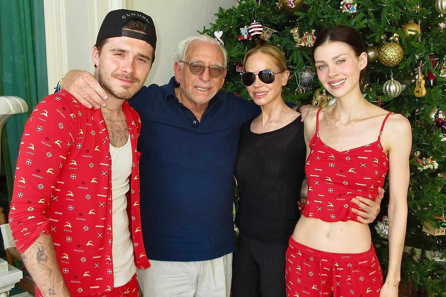 Nicola Peltz-Beckham with her husband Brooklyn and her parents in December 2023.